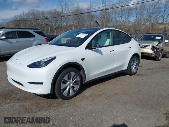 2024 Tesla Model Y with VIN 7SAYGDED2RF089010, listed as a IAAI auction lot 41630222 with 18,366 mi miles and . Bid and sale history available at carsss.com. Image 2.