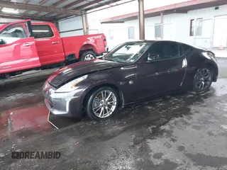 2016 Nissan 370Z with VIN JN1AZ4EHXGM935516, listed as a IAAI auction lot 41966014 with 92,147 mi miles. Bid and sale history available at carsss.com. Image 2.