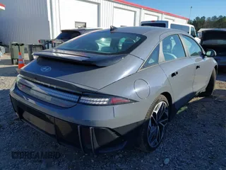 2023 Hyundai IONIQ 6 SEL with VIN KMHM34AC1PA037860, listed as a IAAI auction lot 41133163 with 7,334 mi miles. Bid and sale history available at carsss.com. Image 4.