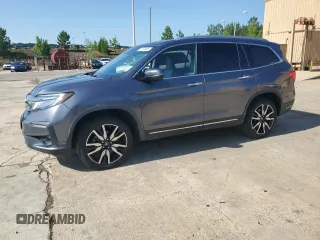 2020 Honda Pilot Touring 8-Passenger with VIN 5FNYF6H90LB027809, listed as a Copart auction lot 57673605 with 74,580 mi miles and Salvage title. Bid and sale history available at DreamBid. Image 1.