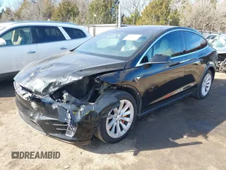 2018 Tesla Model X 75D with VIN 5YJXCDE44JF091690, listed as a IAAI auction lot 41585617 with 128,826 mi miles and . Bid and sale history available at DreamBid. Image 2.
