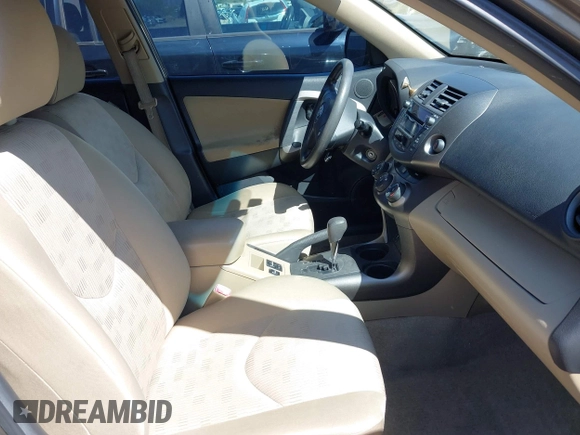 2009 Toyota RAV4 with VIN JTMZF33V69D009256, listed as a IAAI auction lot 41989009 with 142,456 mi miles. Bid and sale history available at carsss.com. Image 5.