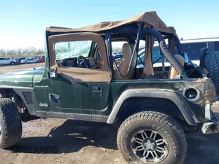 1998 Jeep Wrangler SE with VIN 1J4FY29P6WP709203, listed as a IAAI auction lot 41962877 with 1 mi miles. Bid and sale history available at carsss.com. Image 13.