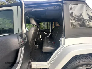 2016 Jeep Wrangler Unlimited Sahara with VIN 1C4BJWEG5GL215915, listed as a Copart auction lot 61690145 with 143,925 mi miles and Clean title. Bid and sale history available at DreamBid. Image 12.