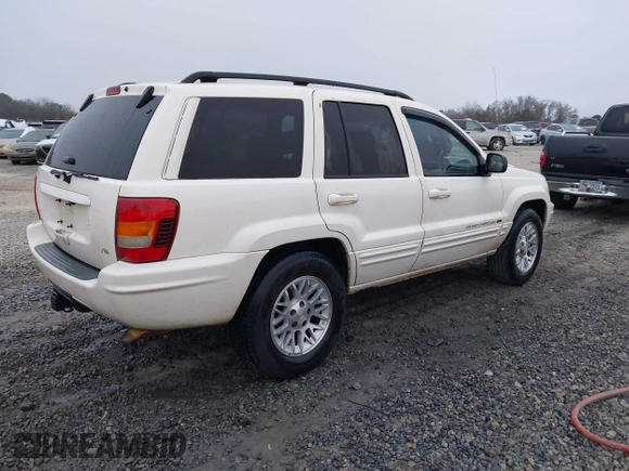 2002 Jeep Grand Cherokee Limited with VIN 1J8GX58N42C283956, listed as a IAAI auction lot 41553997 with 214,388 mi miles and . Bid and sale history available at DreamBid. Image 4.