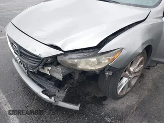 2014 Mazda 6 i Touring with VIN JM1GJ1V60E1141831, listed as a IAAI auction lot 42131200 with 86,597 mi miles and . Bid and sale history available at DreamBid. Image 6.