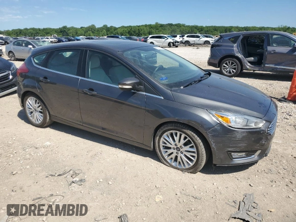 2017 Ford Focus Titanium с VIN 1FADP3N2XHL287713, выставлен на аукционе Copart как лот 57823155 с пробегом 51 828 миль миль и Списание • Salvage title. История ставок и продаж доступна на DreamBid. Изображение 4.