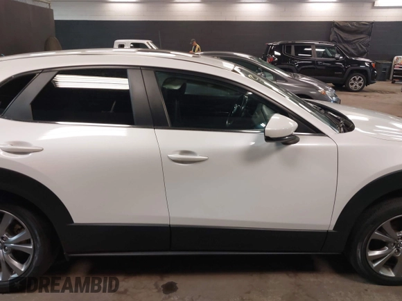 2021 Mazda CX-30 Preferred z VIN 3MVDMBCL2MM210902, wystawiony jako IAAI lot #42522203 z przebiegiem 42 995 mil mil oraz . Historia ofert i sprzedaży dostępna na DreamBid. Obrazek 14.