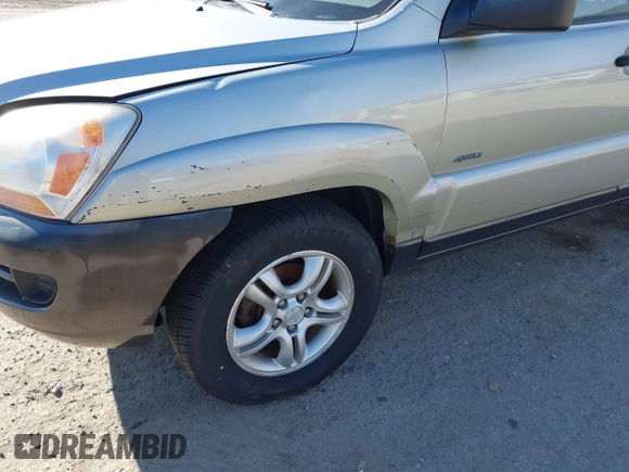 2005 Kia Sportage LX with VIN KNDJE723757081826, listed as a IAAI auction lot 41775450 with 106,992 mi miles and . Bid and sale history available at carsss.com. Image 6.