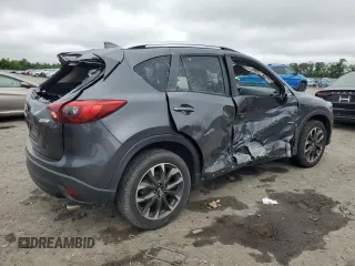 2016 Mazda CX-5 Grand Touring z VIN JM3KE4DY5G0741800, wystawiony jako Copart lot #58565455 z przebiegiem 33 675 mil mil oraz Szkoda całkowita • Salvage title. Historia ofert i sprzedaży dostępna na DreamBid. Obrazek 3.