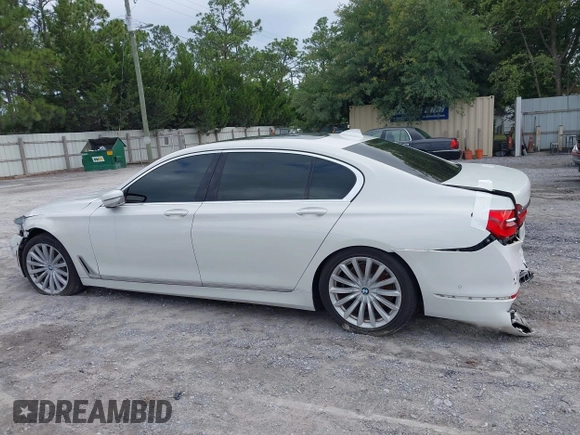 2017 BMW 7 Series 740i z VIN WBA7E2C53HG740273, wystawiony jako IAAI lot #42475769 z przebiegiem Nie podano mil oraz . Historia ofert i sprzedaży dostępna na DreamBid. Obrazek 14.