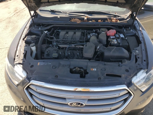 2015 Ford Taurus SEL with VIN 1FAHP2E8XFG209390, listed as a Copart auction lot 58992305 with 99,498 mi miles and Salvage title. Bid and sale history available at DreamBid. Image 11.