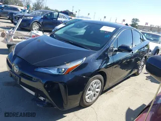 2021 Toyota Prius L Eco with VIN JTDKAMFU3M3148574, listed as a IAAI auction lot 41624303 with 89,747 mi miles. Bid and sale history available at carsss.com. Image 2.