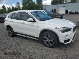 2018 BMW X1 xDrive28i with VIN WBXHT3C35J5L29298, listed as a Copart auction lot 59041435 with 27,612 mi miles and Salvage title. Bid and sale history available at DreamBid. Image 4.