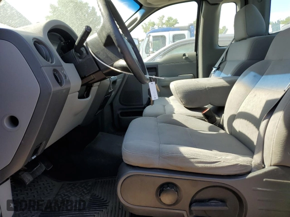 2005 Ford F-150 XL with VIN 1FTRF12W85NB33192, listed as a Copart auction lot 57240225 with 104,331 mi miles and Salvage title. Bid and sale history available at DreamBid. Image 7.