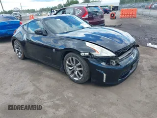 2013 Nissan 370Z Touring z VIN JN1AZ4EH2DM881270, wystawiony jako IAAI lot #42313769 z przebiegiem 111 449 mil mil oraz . Historia ofert i sprzedaży dostępna na DreamBid. Obrazek 1.