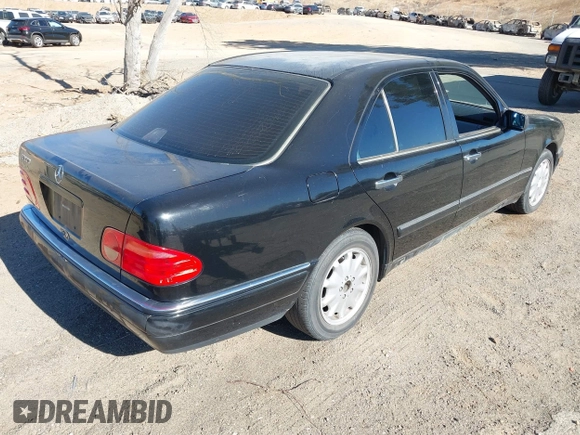 1997 Mercedes-Benz E-Class with VIN WDBJF55F6VJ032691, listed as a IAAI auction lot 40807926 with 215,262 mi miles. Bid and sale history available at carsss.com. Image 4.