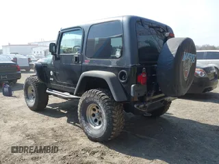 2004 Jeep Wrangler Rubicon with VIN 1J4FA69S64P789308, listed as a IAAI auction lot 41714489 with 186,302 mi miles. Bid and sale history available at carsss.com. Image 3.