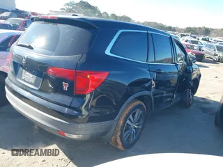 2016 Honda Pilot EX-L with VIN 5FNYF5H59GB005482, listed as a IAAI auction lot 41304248 with 127,092 mi miles and . Bid and sale history available at DreamBid. Image 4.