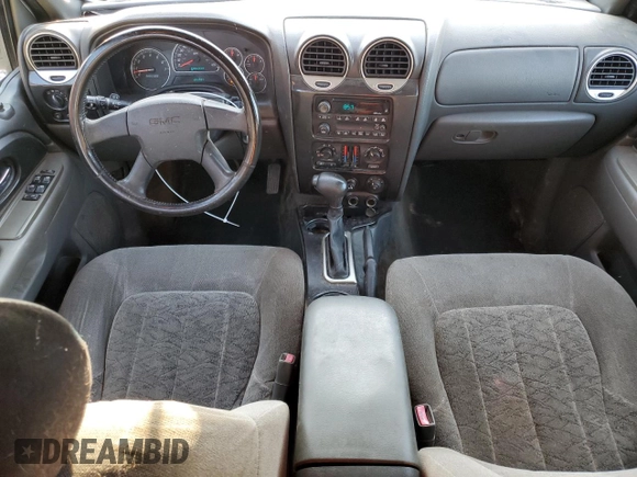 2003 GMC Envoy SLE z VIN 1GKDS13S532369187, wystawiony jako Copart lot #79922934 z przebiegiem 223 997 mil mil oraz Szkoda całkowita • Salvage title. Historia ofert i sprzedaży dostępna na DreamBid. Obrazek 8.