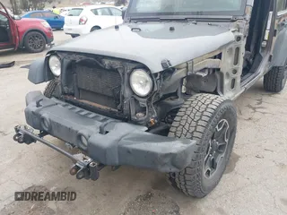 2014 Jeep Wrangler Unlimited Sport with VIN 1C4BJWDG7EL244749, listed as a IAAI auction lot 41871127 with 128,420 mi miles and . Bid and sale history available at DreamBid. Image 18.