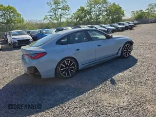 2024 BMW i4 M50 z VIN WBY33AW00RFT04066, wystawiony jako Copart lot #57458105 z przebiegiem 4754 mil mil oraz Szkody całkowita. Historia ofert i sprzedaży dostępna na DreamBid. Obrazek 4.