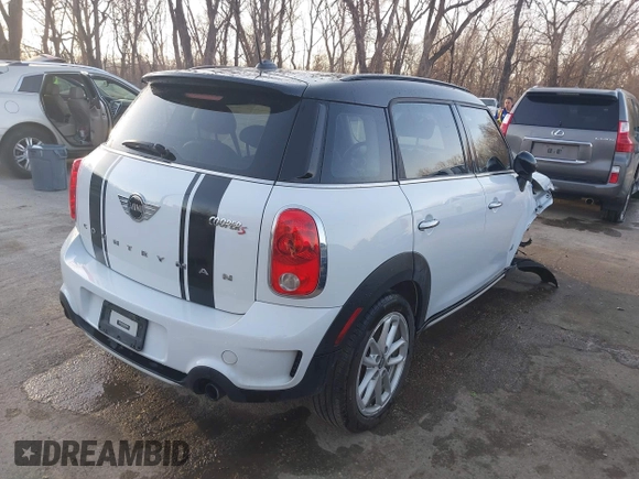2015 MINI Cooper Countryman S with VIN WMWZC5C50FWP42324, listed as a IAAI auction lot 41795698 with 95,746 mi miles. Bid and sale history available at carsss.com. Image 4.