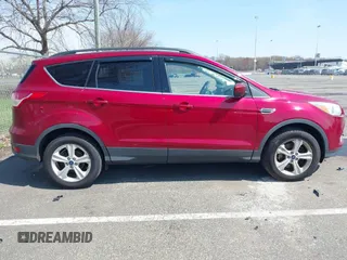 2016 Ford Escape SE with VIN 1FMCU9G99GUA89298, listed as a IAAI auction lot 42013116 with 192,408 mi miles. Bid and sale history available at carsss.com. Image 13.