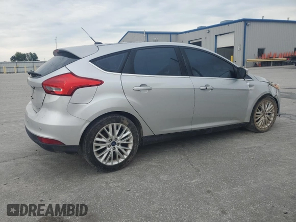 2017 Ford Focus Titanium with VIN 1FADP3N27HL251297, listed as a Copart auction lot 67373094 with 104,733 mi miles and Salvage Title. Bid and sale history available at carsss.com. Image 3.