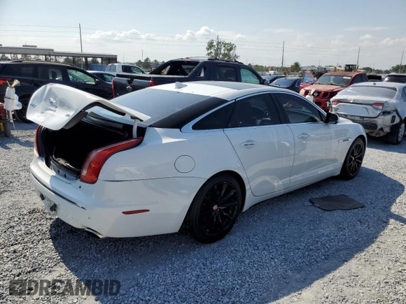 2015 Jaguar XJ with VIN SAJWA1CZ8F8V81637, listed as a Copart auction lot 55619555 with 88,328 mi miles and Salvage Title. Bid and sale history available at DreamBid. Image 3.