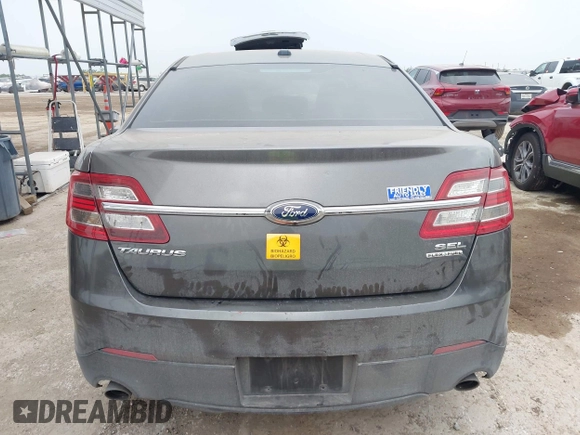2015 Ford Taurus SEL z VIN 1FAHP2E85FG209085, wystawiony jako IAAI lot #41944532 z przebiegiem 143 850 mil mil oraz . Historia ofert i sprzedaży dostępna na DreamBid. Obrazek 16.