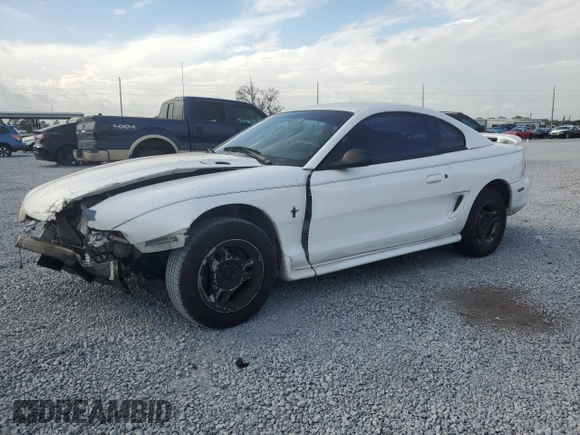 1997 Ford Mustang with VIN 1FALP4044VF174876, listed as a Copart auction lot 41601355 with 103,828 mi miles and Salvage Title. Bid and sale history available at carsss.com. Image 1.