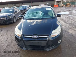 2013 Ford Focus SE z VIN 1FADP3F27DL342384, wystawiony jako IAAI lot #41474290 z przebiegiem 125 664 mil mil oraz . Historia ofert i sprzedaży dostępna na DreamBid. Obrazek 13.