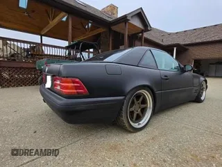 1999 Mercedes-Benz SL-Class with VIN WDBFA68FXXF184548, listed as a Copart auction lot 48104955 with 133,450 mi miles and Clean Title. Bid and sale history available at carsss.com. Image 4.