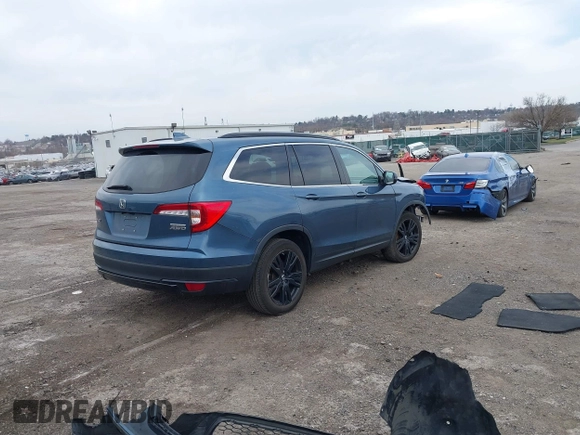 2021 Honda Pilot Special Edition with VIN 5FNYF6H25MB024702, listed as a IAAI auction lot 41833171 with 64,459 mi miles. Bid and sale history available at carsss.com. Image 4.