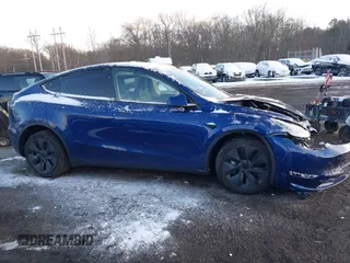 2024 Tesla Model Y Long Range with VIN 7SAYGDEE2RF129577, listed as a IAAI auction lot 41357180 with 6,697 mi miles and . Bid and sale history available at DreamBid. Image 13.