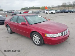 2001 Cadillac Seville z VIN 1G8KS54Y91U227846, wystawiony jako IAAI lot #42134095 z przebiegiem 216 766 mil mil oraz . Historia ofert i sprzedaży dostępna na DreamBid. Obrazek 1.