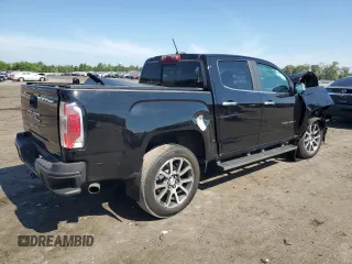 2021 GMC Canyon 4WD Denali with VIN 1GTG6EEN9M1255163, listed as a Copart auction lot 59868834 with 63,853 mi miles and Salvage Title. Bid and sale history available at carsss.com. Image 3.