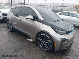 2014 BMW i3 with VIN WBY1Z4C58EV276329, listed as a IAAI auction lot 41570602 with 87,925 mi miles. Bid and sale history available at carsss.com. Image 1.
