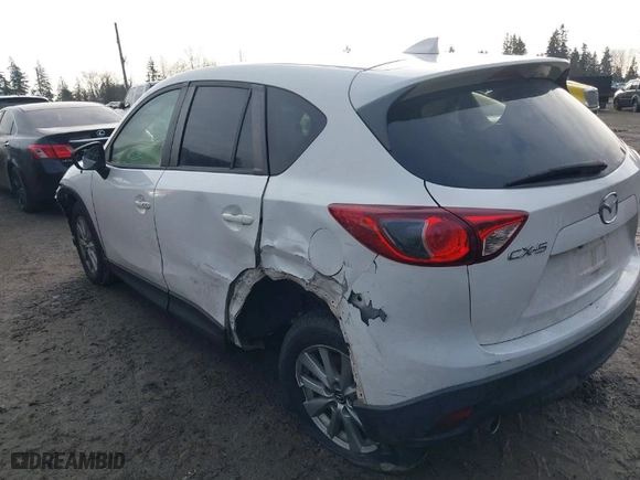 2016 Mazda CX-5 Touring with VIN JM3KE2CY1G0701106, listed as a IAAI auction lot 41514966 with NaN miles. Bid and sale history available at carsss.com. Image 3.