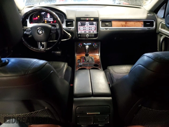 2011 Volkswagen Touareg Exec with VIN WVGFK9BP8BD003948, listed as a Copart auction lot 48285065 with 152,497 mi miles and Salvage Title. Bid and sale history available at DreamBid. Image 8.