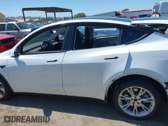 2023 Tesla Model Y Long Range with VIN 7SAYGDEE1PF660444, listed as a IAAI auction lot 42065046 with 23,601 mi miles and . Bid and sale history available at DreamBid. Image 15.