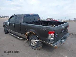 2005 Ford F-150 XLT with VIN 1FTPX14515NA43732, listed as a IAAI auction lot 41901453 with 216,729 mi miles. Bid and sale history available at carsss.com. Image 3.