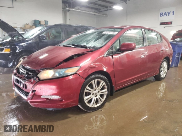 2010 Honda Insight LX with VIN JHMZE2H52AS034613, listed as a Copart auction lot 52701795 with 232,541 mi miles and Salvage Title. Bid and sale history available at DreamBid. Image 1.