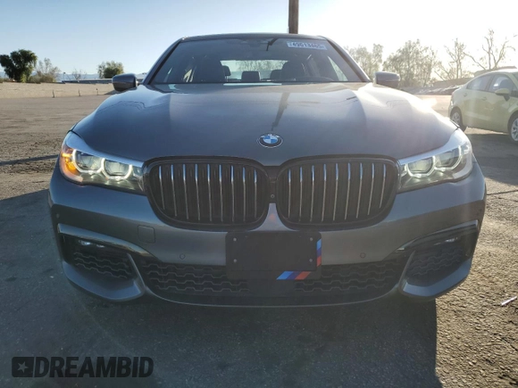 2017 BMW 7 Series 740i with VIN WBA7E2C32HG740988, listed as a Copart auction lot 49613465 with 63,646 mi miles and Salvage Title. Bid and sale history available at carsss.com. Image 5.