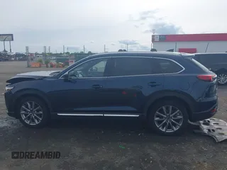 2020 Mazda CX-9 Grand Touring with VIN JM3TCBDY1L0402718, listed as a IAAI auction lot 42355511 with 87,205 mi miles and . Bid and sale history available at DreamBid. Image 14.