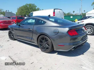 2020 Ford Mustang EcoBoost z VIN 1FA6P8TH1L5183279, wystawiony jako IAAI lot #41904731 z przebiegiem 99 222 mil mil oraz . Historia ofert i sprzedaży dostępna na DreamBid. Obrazek 3.