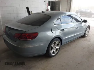 2013 Volkswagen CC Sport with VIN WVWBP7AN1DE567561, listed as a IAAI auction lot 42174906 with 157,827 mi miles. Bid and sale history available at carsss.com. Image 4.