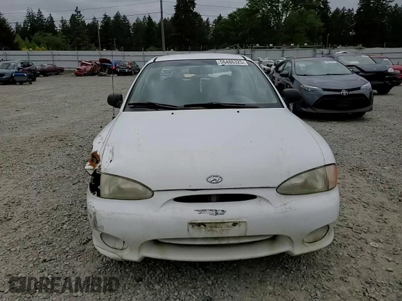 1999 Hyundai Accent with VIN KMHVD14N9XU503210, listed as a Copart auction lot 56486325 with 195,501 mi miles and Salvage title. Bid and sale history available at DreamBid. Image 13.
