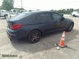 2012 BMW 5 Series Gran Turismo 550i xDrive with VIN WBASP4C53CC341928, listed as a IAAI auction lot 36580839 with 93,808 mi miles. Bid and sale history available at carsss.com. Image 4.